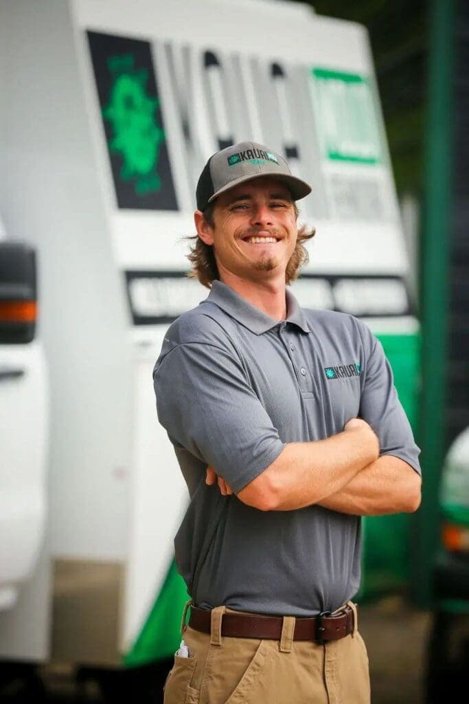 Tanner Diehl, Oahu regional restoration manager, standing in front of a company response van